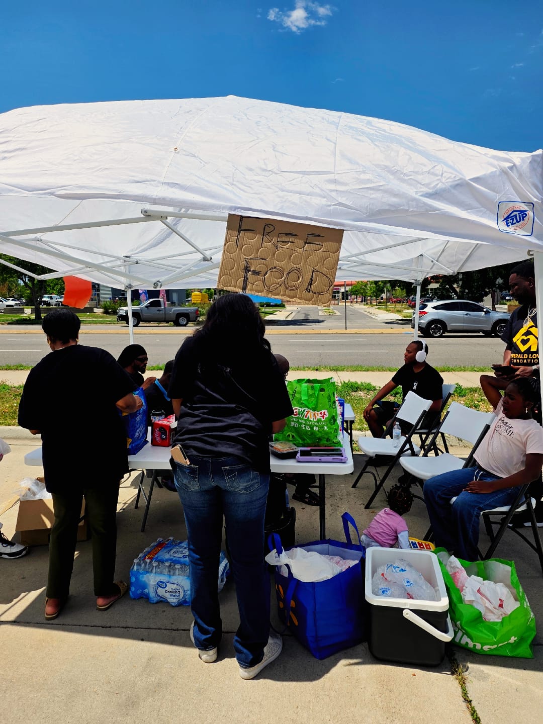 ELF volunteers serving at the free food outreach booth
