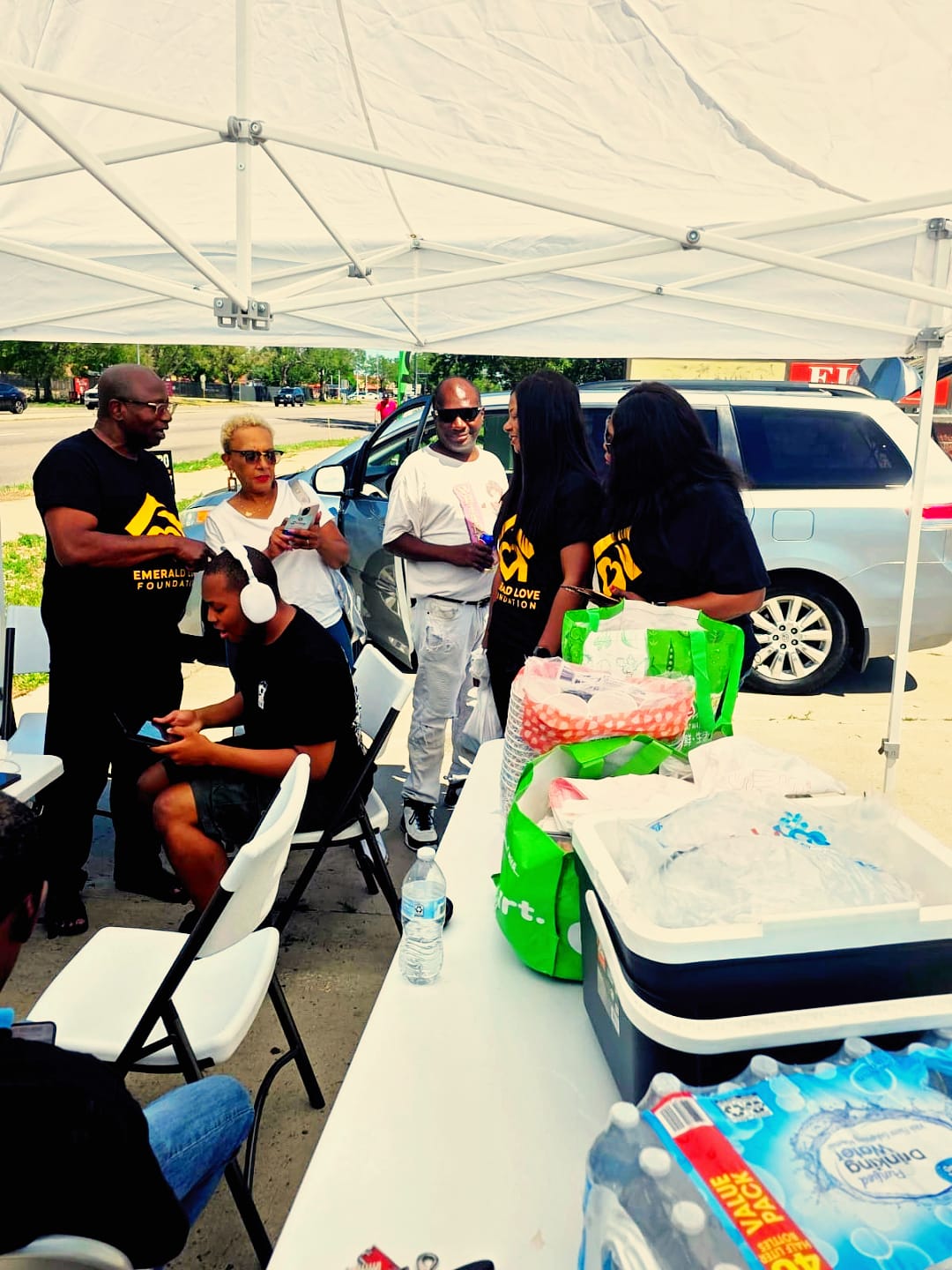 ELF volunteers coordinating under outreach tent