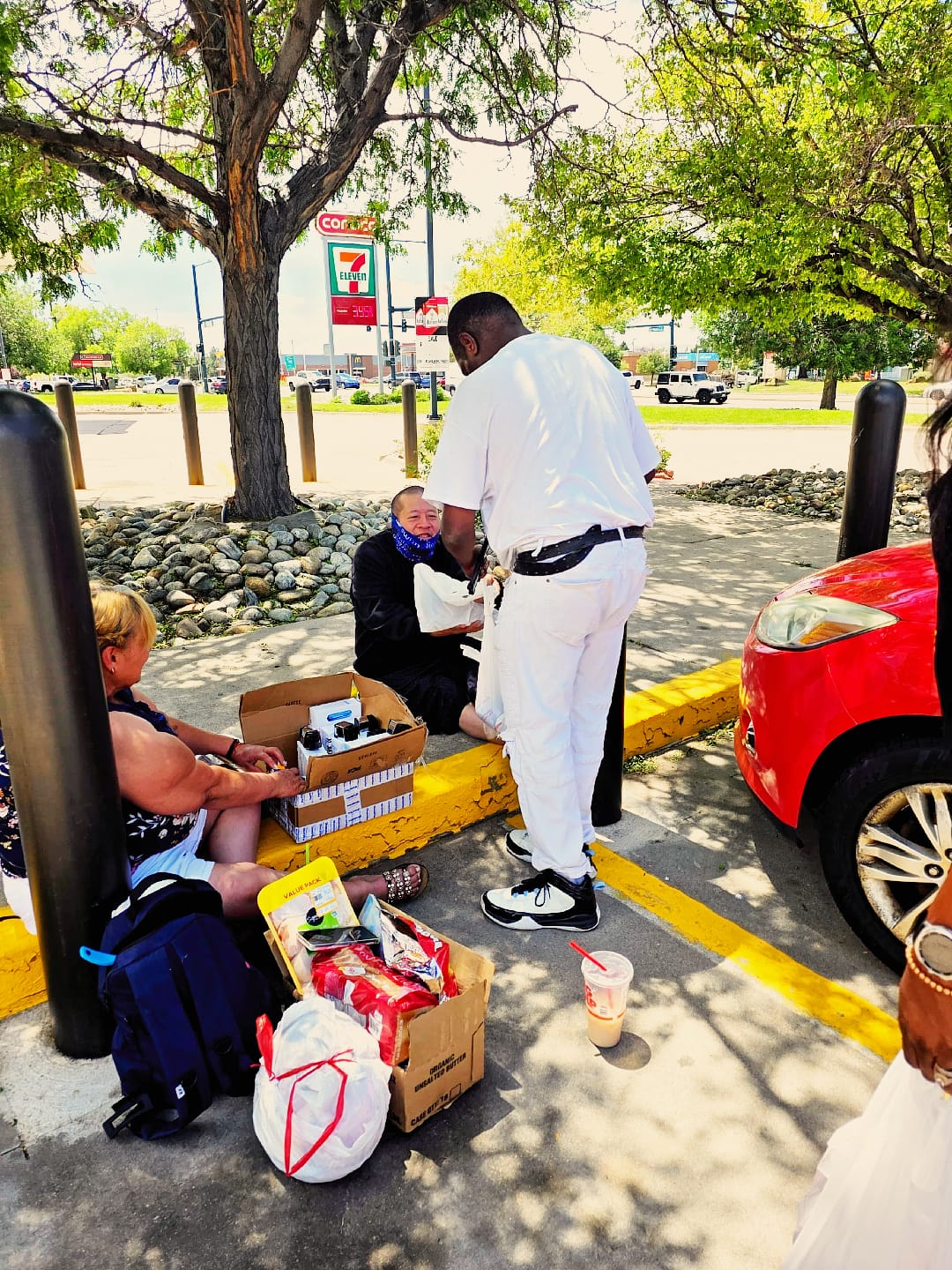 ELF volunteer distributing supplies to people in need